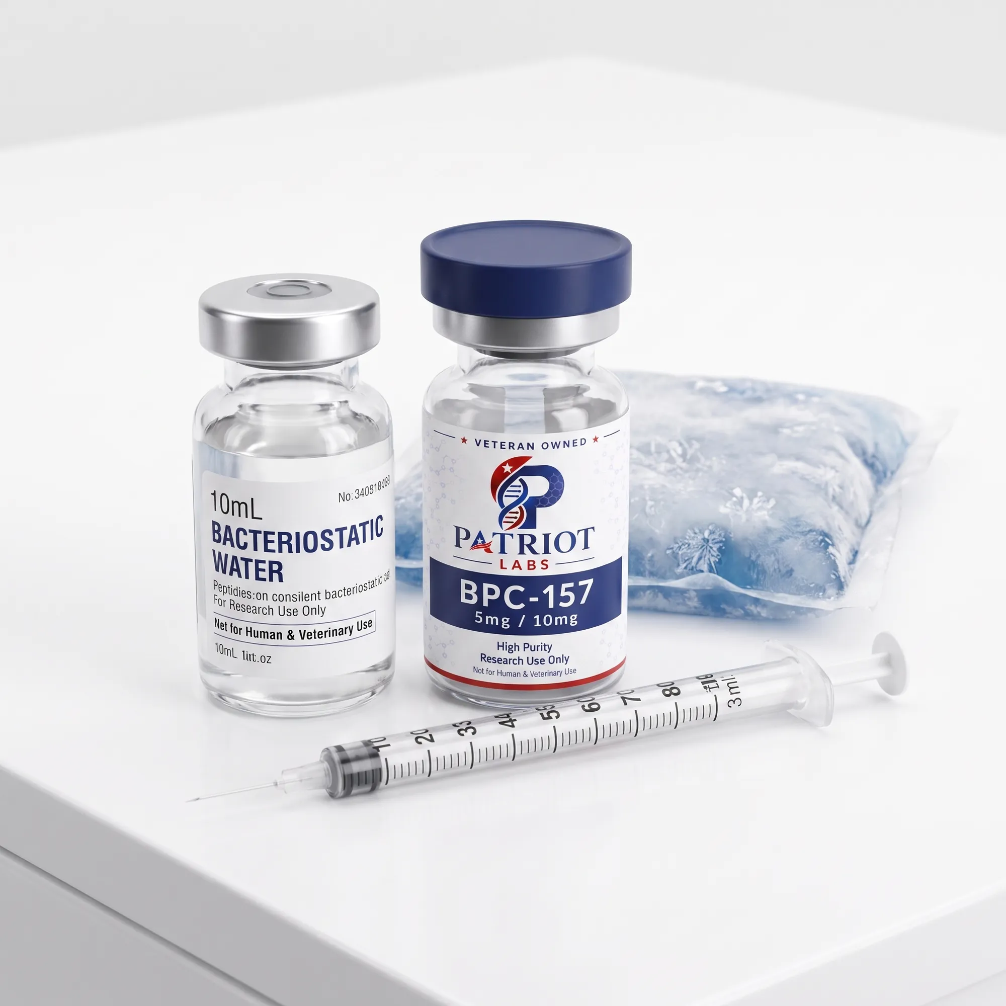 Research vial, bacteriostatic water and cold pack on a lab bench